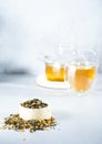 Japanese green tea Genmaicha.Tea leaves with fried brown rice on a bright gray background with a shadow.Slimming trend tea concept Royalty Free Stock Photo