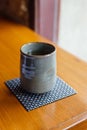 Japanese green tea grey ceramic cup on wooden table Royalty Free Stock Photo