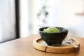 Japanese green tea ice cream with red bean topping on wooden tray in coffee shop Royalty Free Stock Photo