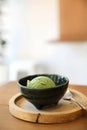 Japanese green tea ice cream with red bean topping on wooden table in coffee shop Royalty Free Stock Photo