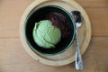 Japanese green tea ice cream with red bean topping on wooden table Royalty Free Stock Photo