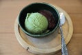 Japanese green tea ice cream with red bean topping on wooden table in coffee shop Royalty Free Stock Photo