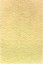 A Japanese greeting card with a traditional lace circles motif pattern on a golden paper background