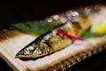 Japanese grill fresh fish with lemon macro Royalty Free Stock Photo