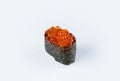 Japanese Gunkan Ikura Sushi with salmon caviar and rice wrapped in nori seaweed. Side view of Pan Asian dish