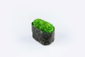Japanese Gunkan Sushi with green Tobiko caviar and rice wrapped in nori seaweed. Royalty Free Stock Photo