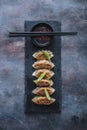 Japanese gyoza dumplings on black stone plate, copy space Royalty Free Stock Photo