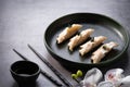 Japanese gyoza dumplings on grey stone table background. Traditional asian food