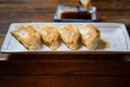 Japanese gyoza served in plate with delicious soy sauce dip Royalty Free Stock Photo