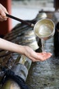 Japanese hand cleansing ritual Royalty Free Stock Photo