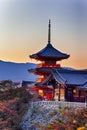 Japanese Heritage. Vivid Sunset Over Kiyomizu-dera Temple Pagoda With Traditional Red Maple Trees in Background in Kyoto, Japan Royalty Free Stock Photo