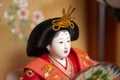 A Japanese hina doll in red kimono Royalty Free Stock Photo