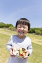 Japanese infant who is delighted with bento, Royalty Free Stock Photo