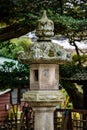 Japanese Ishi-doro stone lantern in Japan and trees in the background