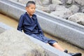 Japanese junior high school student playing in the river with water slide Royalty Free Stock Photo
