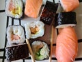 Japanese kanpyo sushi rolls makizushi sushi roll with avocado radish and avocado california roll with salami in plate Royalty Free Stock Photo