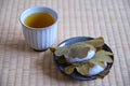 Japanese Kashiwa mochi and green tea on tatami. Royalty Free Stock Photo