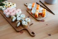 Japanese kitchen rolls on a wooden background, home delivery Royalty Free Stock Photo