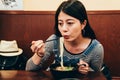 Japanese lady having lunch in local restaurant