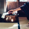 Japanese lady serving tea Royalty Free Stock Photo