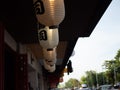 Japanese lantern hung in front of Japanese Restaurant, Japanese text on lantern is \