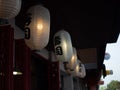 Japanese lantern hung in front of Japanese Restaurant, Japanese text on lantern is \