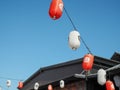 Japanese lantern hung in front of Japanese Restaurant, Japanese text on lantern is \