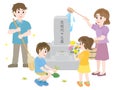 A family of 4 visiting and cleaning a grave during Obon festival