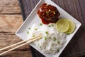 Japanese lunch: hamburg steak or hambagu with sauce and rice noodles close-up. horizontal top view Royalty Free Stock Photo