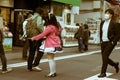 Japanese maid girl handing out flyers to people in Akihabara, Tokyo, Japan