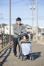 Japanese man pushing a stroller Royalty Free Stock Photo