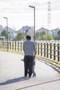 Japanese man pushing a stroller Royalty Free Stock Photo