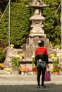 Japanese man with quirky dress sense visiting a temple