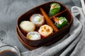 Japanese Meal in a Box Bento with sushi roll eice avocado salmon fish, on gray stone background , with copyspace  and space for Royalty Free Stock Photo