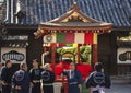 Japanese men in happi kimono in front of a yatai cart in the Sensoji temple.