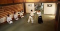 Japanese men, martial arts class or training in fight, modern or aikido to learn self defence. Sensei, black belt Royalty Free Stock Photo