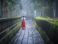 Japanese Miko on Path in Nikko