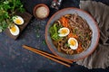 Japanese miso ramen noodles with eggs, carrot and mushrooms. Soup delicious food.