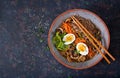 Japanese miso ramen noodles with eggs, carrot and mushrooms. Soup delicious food.