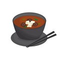 Japanese miso soup in black bowl with mushrooms and tofu. Royalty Free Stock Photo