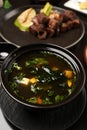 Japanese miso soup in a black bowl vertical Royalty Free Stock Photo
