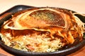 Japanese Modanyaki, a savory pancake filled with fried noodles.