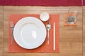 Japanese modern applied dining room style with eastern dish, fork, spoon, napkin and glass on the table Royalty Free Stock Photo