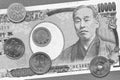 Japanese money: a banknote of 10,000 and coins of 100, 10 and 1 yen close-up. Black and white monochrome light background or Royalty Free Stock Photo