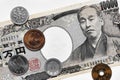 Japanese money: banknote of 10,000 and coins of 100, 10 and 1 yen close-up. Economy, currency and banking in Japan. Flat lay. Royalty Free Stock Photo