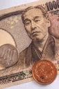 Japanese money, notes and coins, lie on a white paper background. 10000 yen banknote close-up. Aged effect shot. Financial Royalty Free Stock Photo