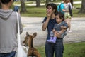 Japanese Mother And Child Looking At Deer At Nara Japan 2015