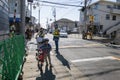 Japanese Mother and her kids crossing the rail way