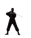 Japanese ninja in black uniform on white background