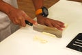 Cutting dough to make Udon Japanese noodles Royalty Free Stock Photo